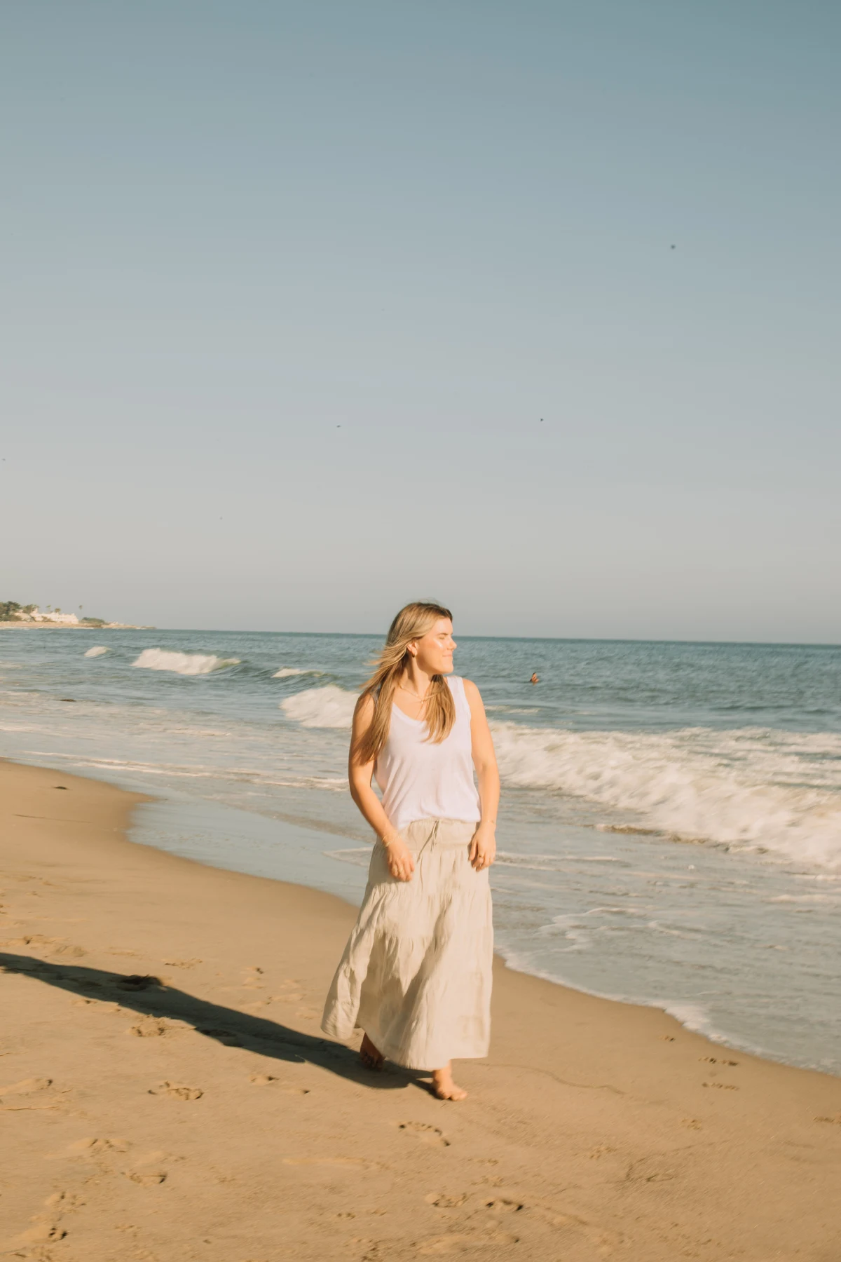 Cambria walking along the beach