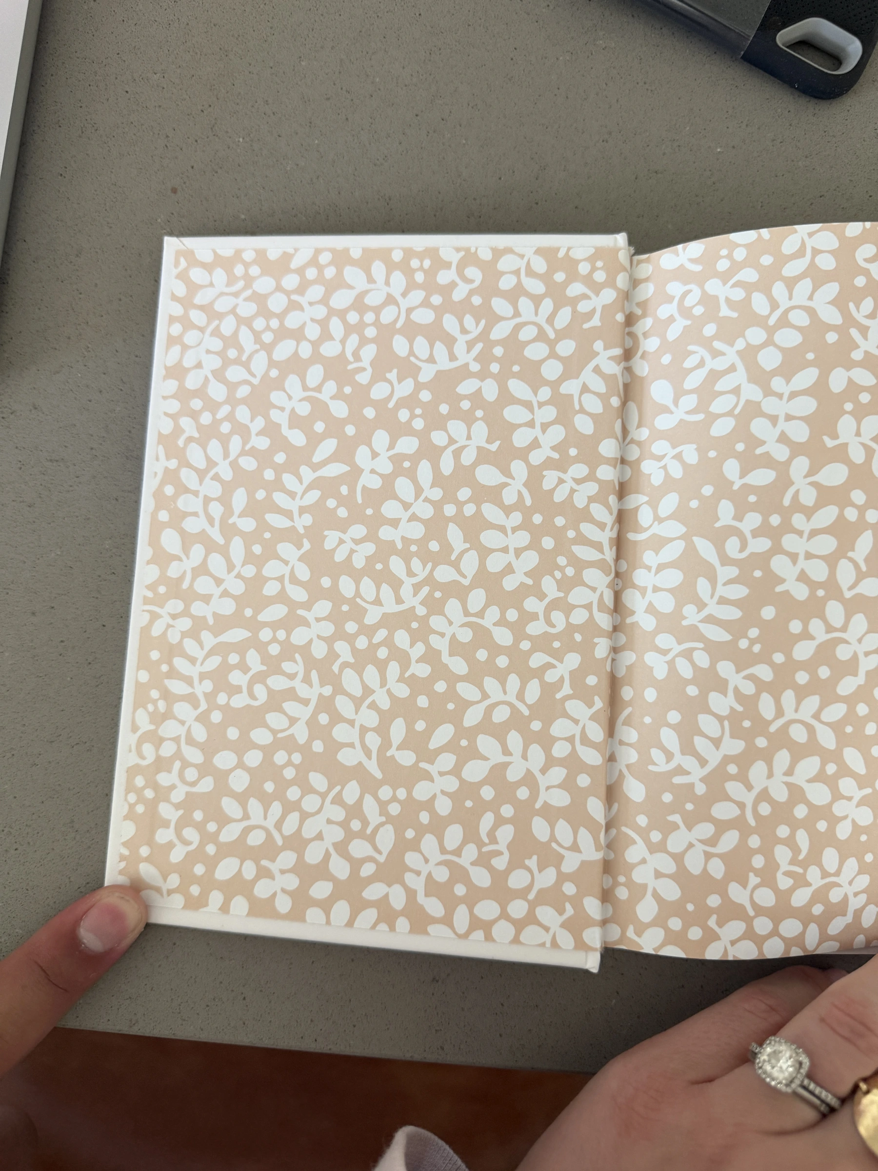 The peach and white floral endpaper inside Milk and Honey